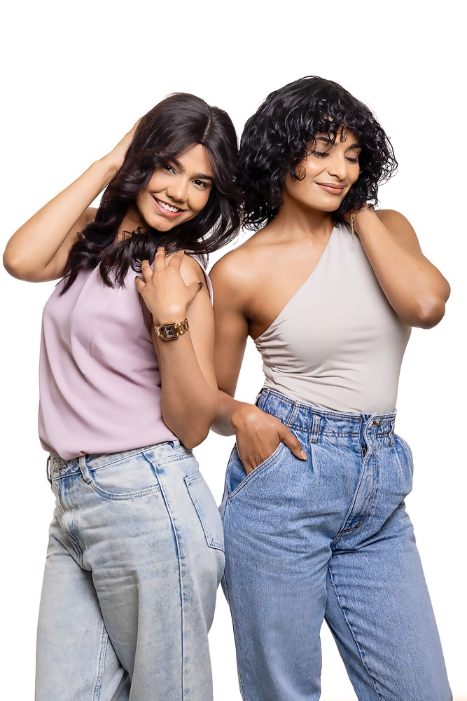 Hair Originals web shoot featuring two models showcasing long wavy and curly hairstyles